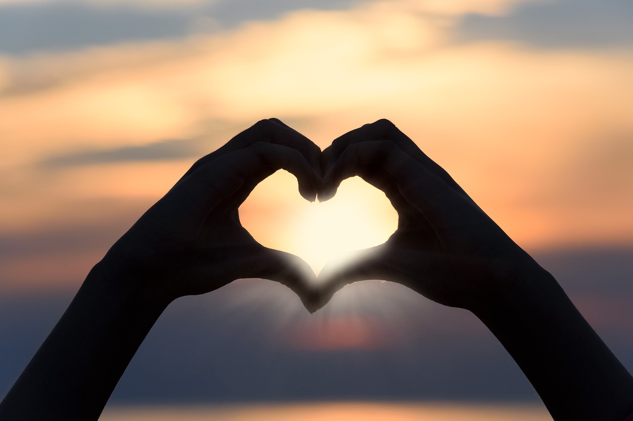 Shadow hands love heart sun
